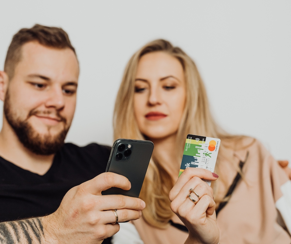 Couple entering credit card information on a laptop while reviewing therapy costs together