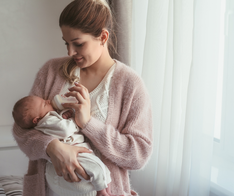 Mother holding her newborn baby in a calm home setting