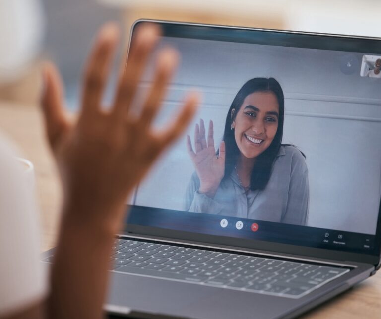 Woman participating in an online somatic therapy session from home