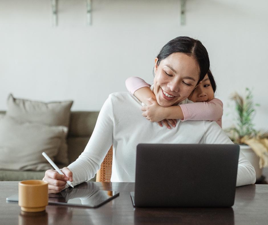 Woman trying to work from home while child plays in the background
