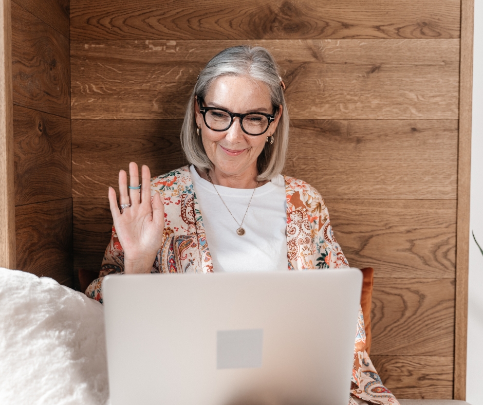 Woman beginning her first online therapy session on a laptop