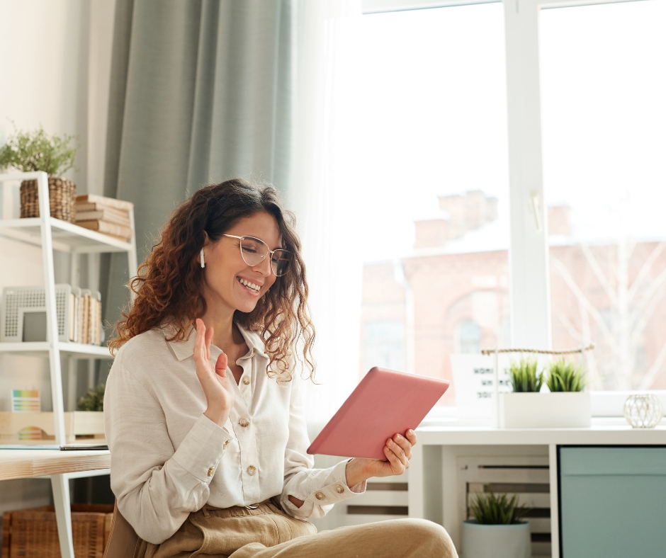 Woman participating in an online therapy session from home while speaking with a licensed therapist