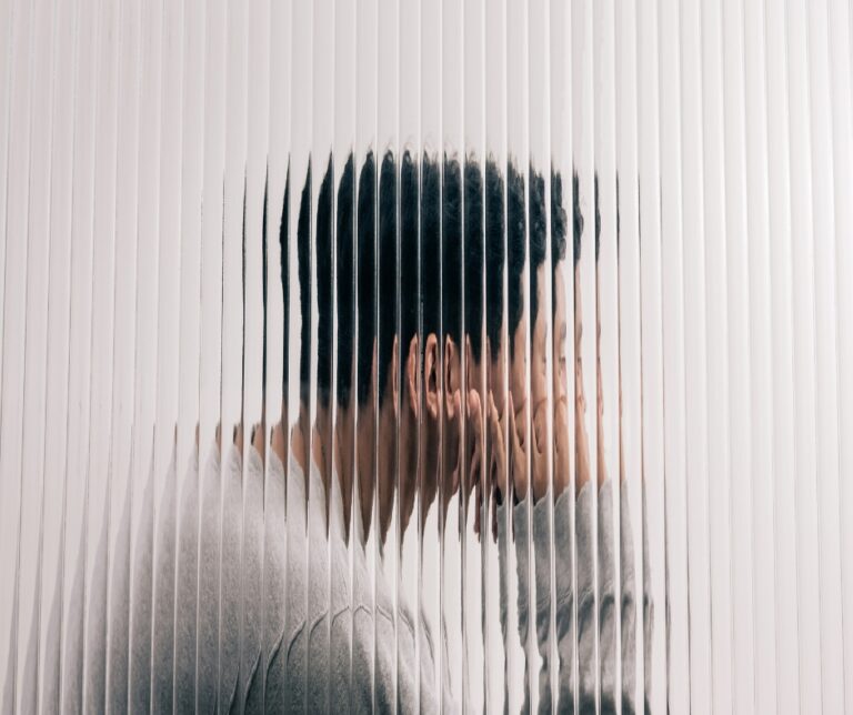 Man experiencing anxiety and stress while sitting alone